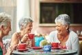 Lifelong friends catching up over coffee. Cropped shot of a group of senior female friends enjoying a lunch date. Royalty Free Stock Photo