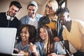 Laughter in between studying helps us stay focused. Cropped shot of a group of university students working on an