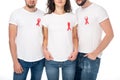 People in blank t-shirts with aids ribbons