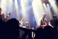 Cropped shot of a guitarist on stage surrounded by adoring fans. This concert was created for the sole purpose of this Royalty Free Stock Photo