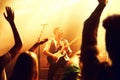 Cropped shot of a guitarist on stage surrounded by adoring fans. This concert was created for the sole purpose of this Royalty Free Stock Photo