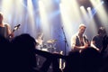 Cropped shot of a guitarist on stage surrounded by adoring fans. This concert was created for the sole purpose of this