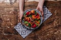 cropped shot of hands holding plate with salad with mussels, vegetables Royalty Free Stock Photo