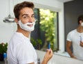 The cream before its all gone. Cropped shot of a handsome man about to shave his beard in the bathroom at home. Royalty Free Stock Photo