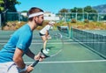 Train like a champion if you want to become one. Cropped shot of a handsome young male tennis player playing together Royalty Free Stock Photo