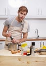 Season to taste. Cropped shot of a handsome young man cooking in the kitchen. Royalty Free Stock Photo