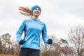 Cropped shot of a young woman running. Royalty Free Stock Photo