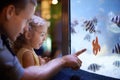 She's focused on those fish. Cropped shot of a little girl on an outing to the aquarium. Royalty Free Stock Photo