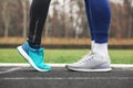 Cropped shot of a male and female legs in running shoes close to Royalty Free Stock Photo