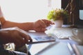 Cropped shot of male hands holding smart phone with blank screen for online shopping over the desk. Royalty Free Stock Photo