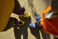 Cropped shot of man and boy legs wearing rollerblades Royalty Free Stock Photo