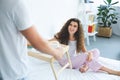 cropped shot of man holding tray with breakfast while smiling girlfriend Royalty Free Stock Photo