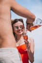 cropped shot of man pouring champagne to smiling young woman Royalty Free Stock Photo