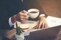 Cropped shot of a man's hands using a laptop at home, rear view Royalty Free Stock Photo