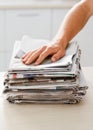 Ready to make something else. Cropped shot of a man with a stack of newspaper. Royalty Free Stock Photo