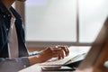 Cropped shot man using computer with typing computer keyboard Royalty Free Stock Photo