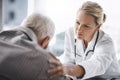 Well get through this. Cropped shot of a mature female doctor working with a senior male patient in her office in the Royalty Free Stock Photo