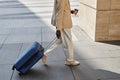 Cropped shot of modern businessman with cup of coffee and suitcase Royalty Free Stock Photo