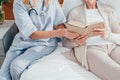 cropped shot of nurse and senior patient reading Royalty Free Stock Photo