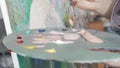 Cropped shot of a palette of a female painter