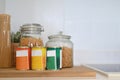 Cropped shot of pasta in jar on kitchen cupboard or pantry to store a stock.