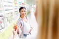 cropped shot of pharmacist giving pills to smiling pregnant woman Royalty Free Stock Photo