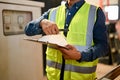Cropped shot, Professional Asian male warehouse manager working in warehouse