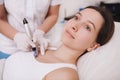 Young woman getting facial skincare treatment