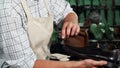 Shoemaker polishing leather shoes with a piece of soft cloth