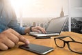 Cropped shot Silhouette of a man's hands using a laptop at home, Royalty Free Stock Photo