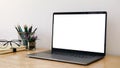 Cropped shot of simple workspace with blank screen laptop, stationery and copy space Royalty Free Stock Photo