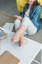 cropped shot of smiling barefoot girl