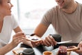 Cropped shot of smiling couple eating breakfast in the morning Royalty Free Stock Photo