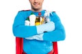 cropped shot of smiling superhero holding cleaning supplies