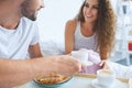 cropped shot of smiling young couple having croissants and coffee for breakfast in bed Royalty Free Stock Photo