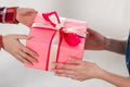 cropped shot of son presenting mothers day gift to Royalty Free Stock Photo