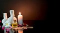 Cropped shot of spa treatment and relax concept with spa accessories, candle and aroma oil