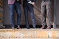 Cropped shot of stylish businessmen in formalwear meeting outdoors at break