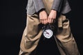 cropped shot of stylish woman holding clock