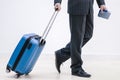 Cropped shot of successful businessman at airport pulling trolley bags ready for international business trip. Royalty Free Stock Photo