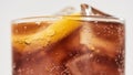 Cropped shot of sweet soda drink, glass of coke with ice cubes and lemon inside Royalty Free Stock Photo