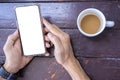 Cropped shot top view of businessman hands using smartphone mockup at the office desk. Royalty Free Stock Photo