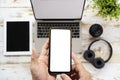 Cropped shot top view of businessman hands using smartphone mockup at the white office desk Royalty Free Stock Photo