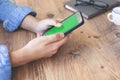 Cropped shot top view of businesswoman hands using smartphone mockup at the wooden office desk. Blank screen mobile phone for grap Royalty Free Stock Photo