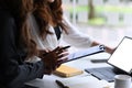 Two business people discussing financial statistics reports together in office. Royalty Free Stock Photo