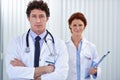 I hope weve made the right diagnosis. Cropped shot of two doctors standing together at work. Royalty Free Stock Photo