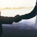 Making global connections. Cropped shot of two unrecognizable businessmen shaking hands while standing at the airport. Royalty Free Stock Photo