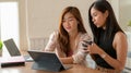 Cropped shot of two young college girl consulting on their project with laptop Royalty Free Stock Photo