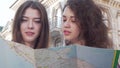 Cropped shot of two young women using a map