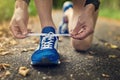 Great fitness starts with great footwear. Cropped shot of an unidentifiable man tying his shoes while out for a run.